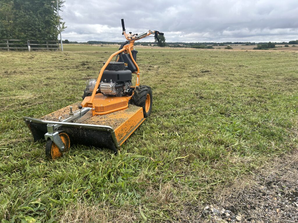Overgrown grass mowing and meadow cutting