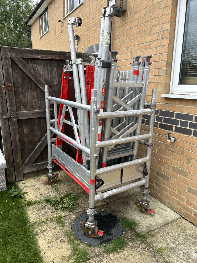 mobile access tower for gutter repairs and gutter cleaning